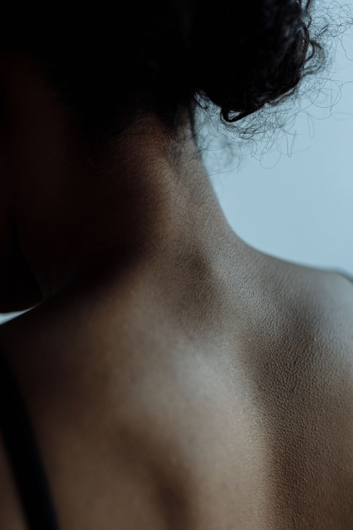 Close up of a woman's neck and shoulder, relaxed