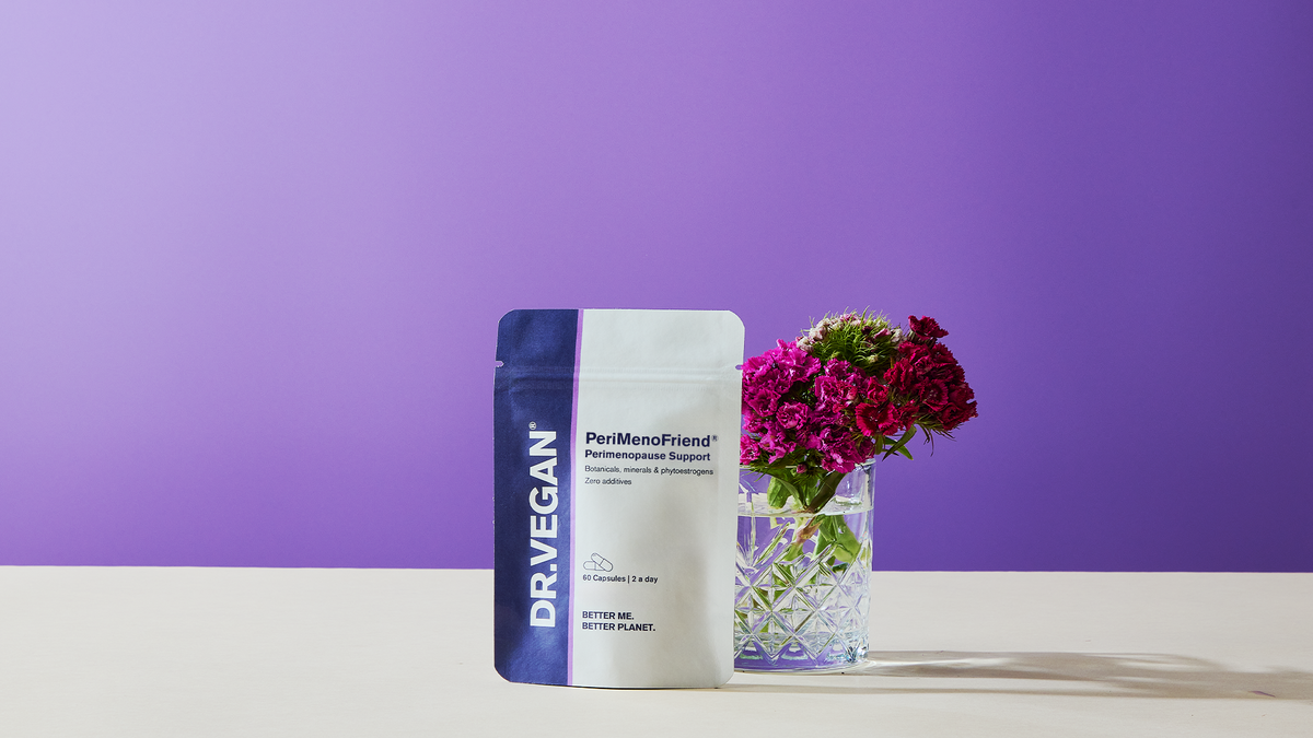 PeriMenoFriend pouch with fresh flowers on a lilac background